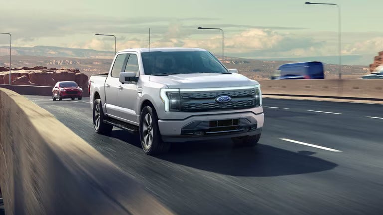 Gray Ford F-150 driving on highway