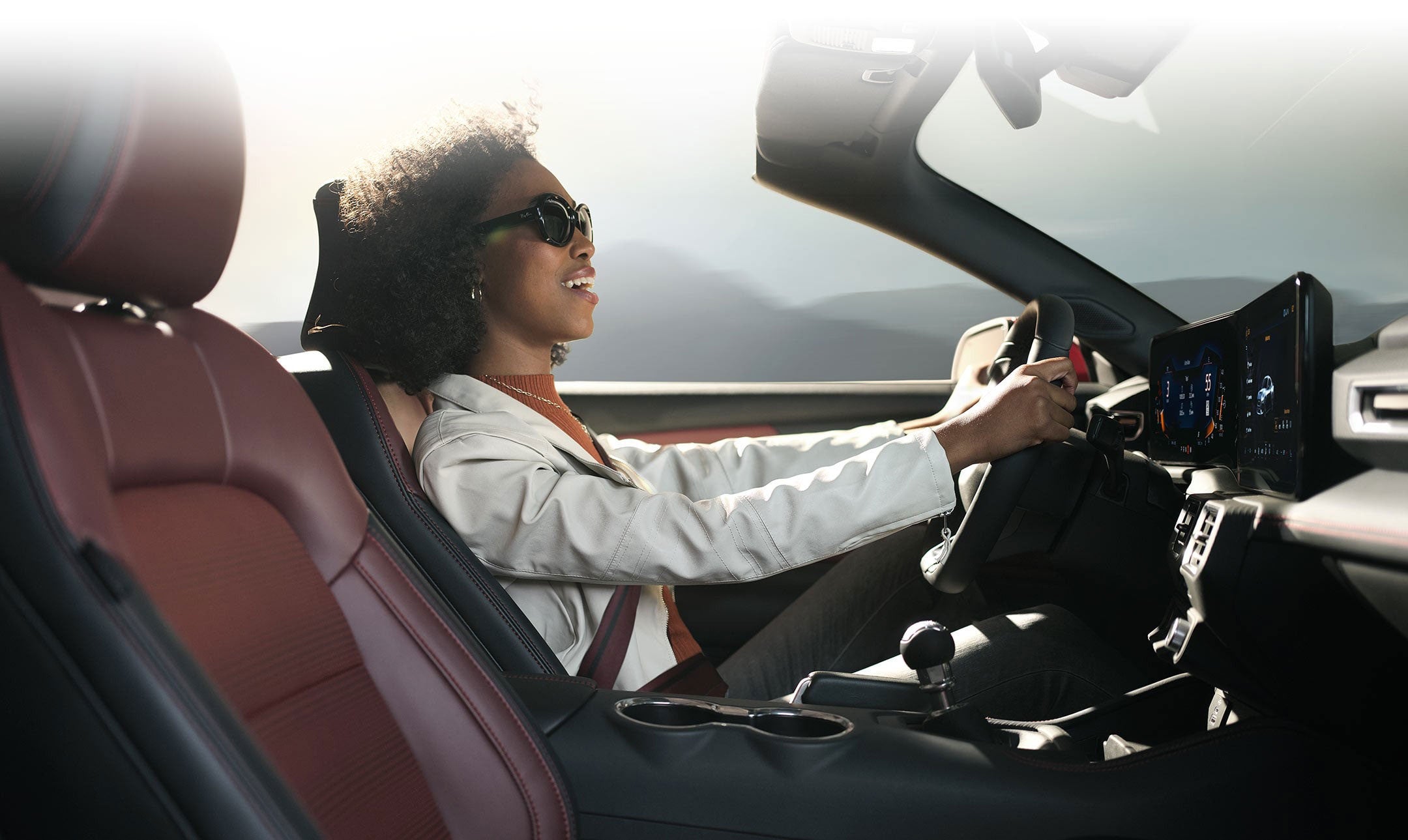 Person sitting in the driver’s seat of a 2024 Ford Mustang® convertible | Dick's Canby Ford in Canby OR